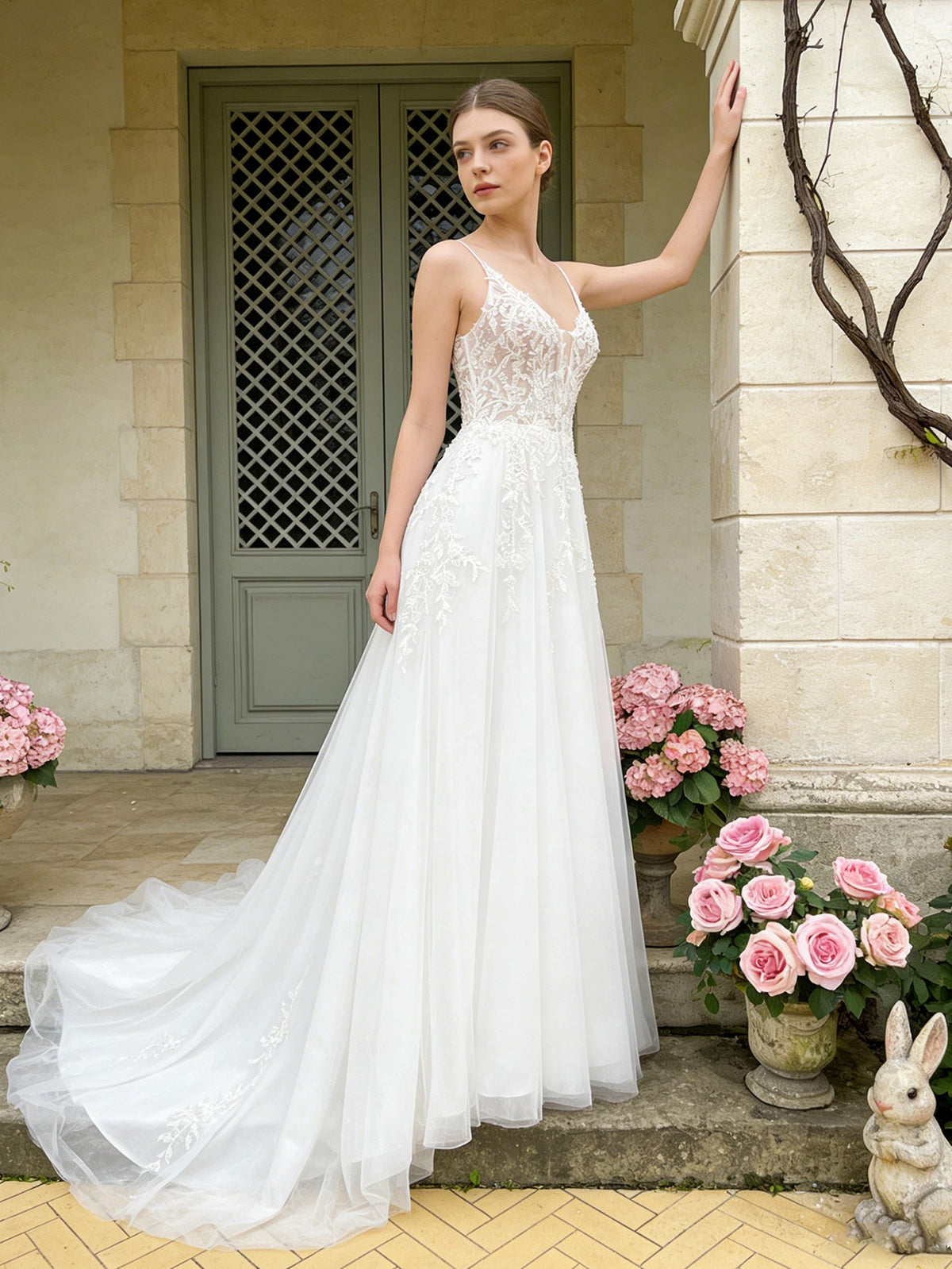 White tulle ball gown wedding dress with lace bodice, spaghetti straps, V-neck