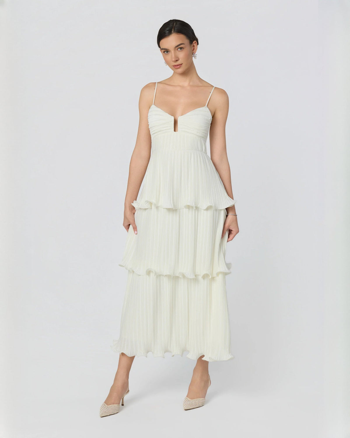 White sleeveless tiered A-line maxi dress with V-neck bodice and ruffle tiers
