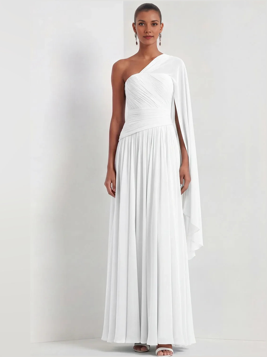 White one-shoulder chiffon maxi dress with ruched bodice and flowing draped overlay.