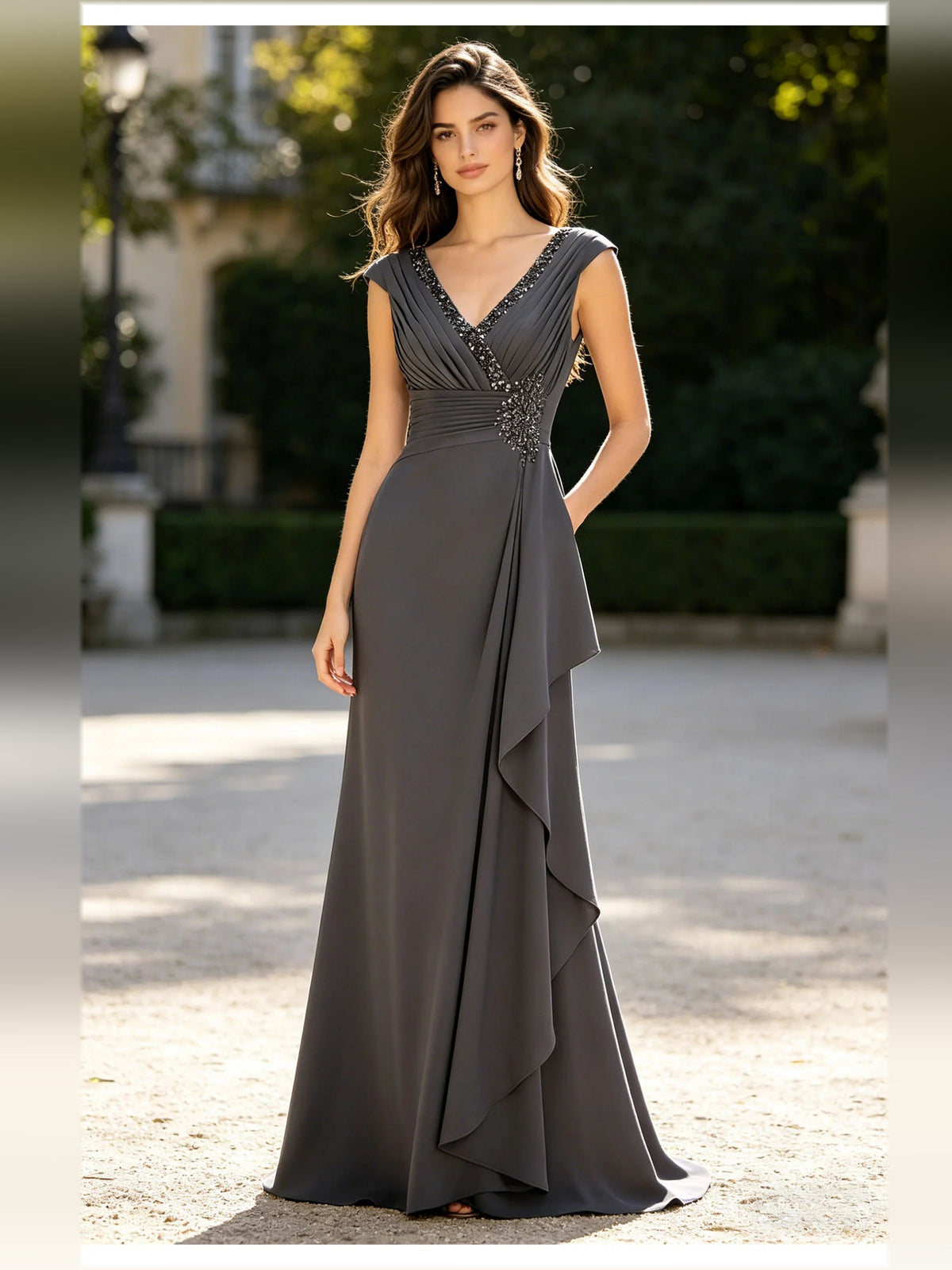 Gray V-neck formal dress with cap sleeves, beaded ruching and layered drape skirt