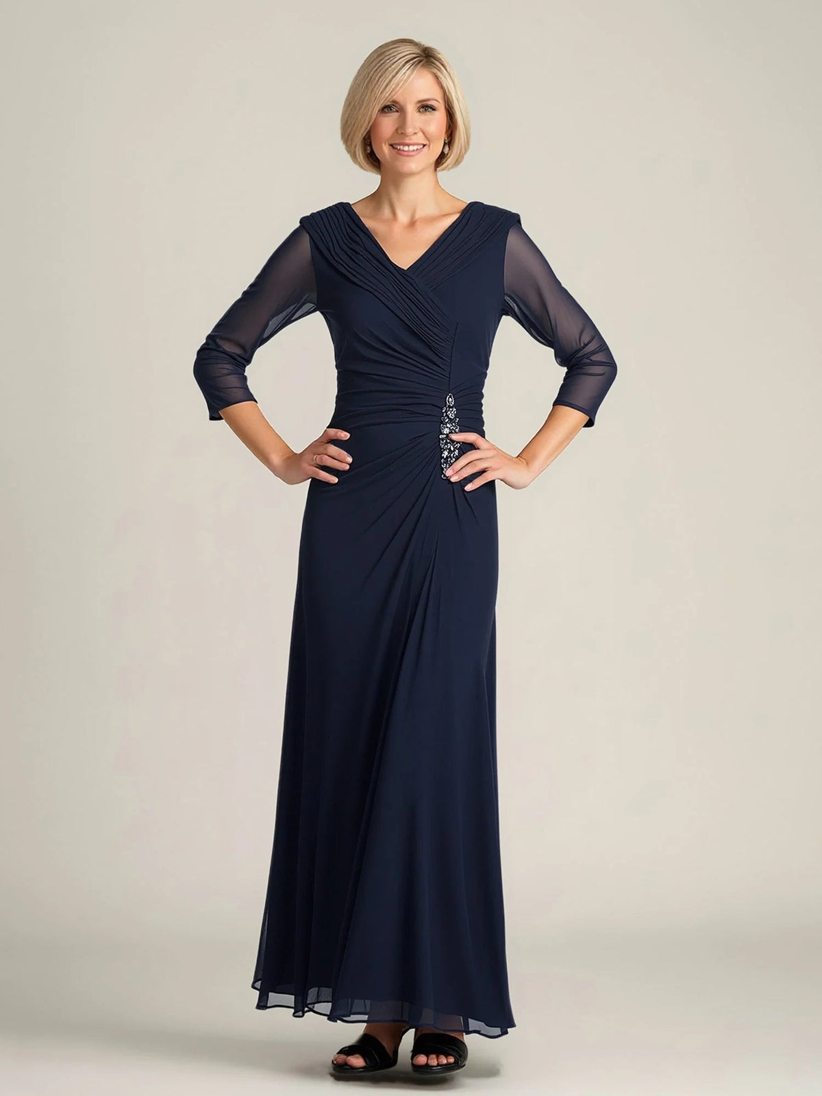 Dark navy V-neck A-line chiffon dress with ruched bodice and vertical beaded embellishment, sheer sleeves