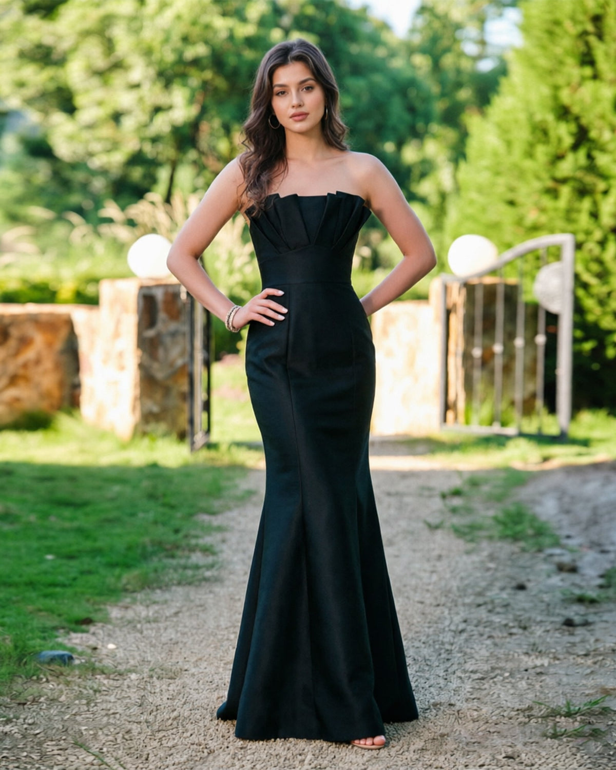 Black strapless mermaid formal dress with pleated bodice, fitted waist, flared hem
