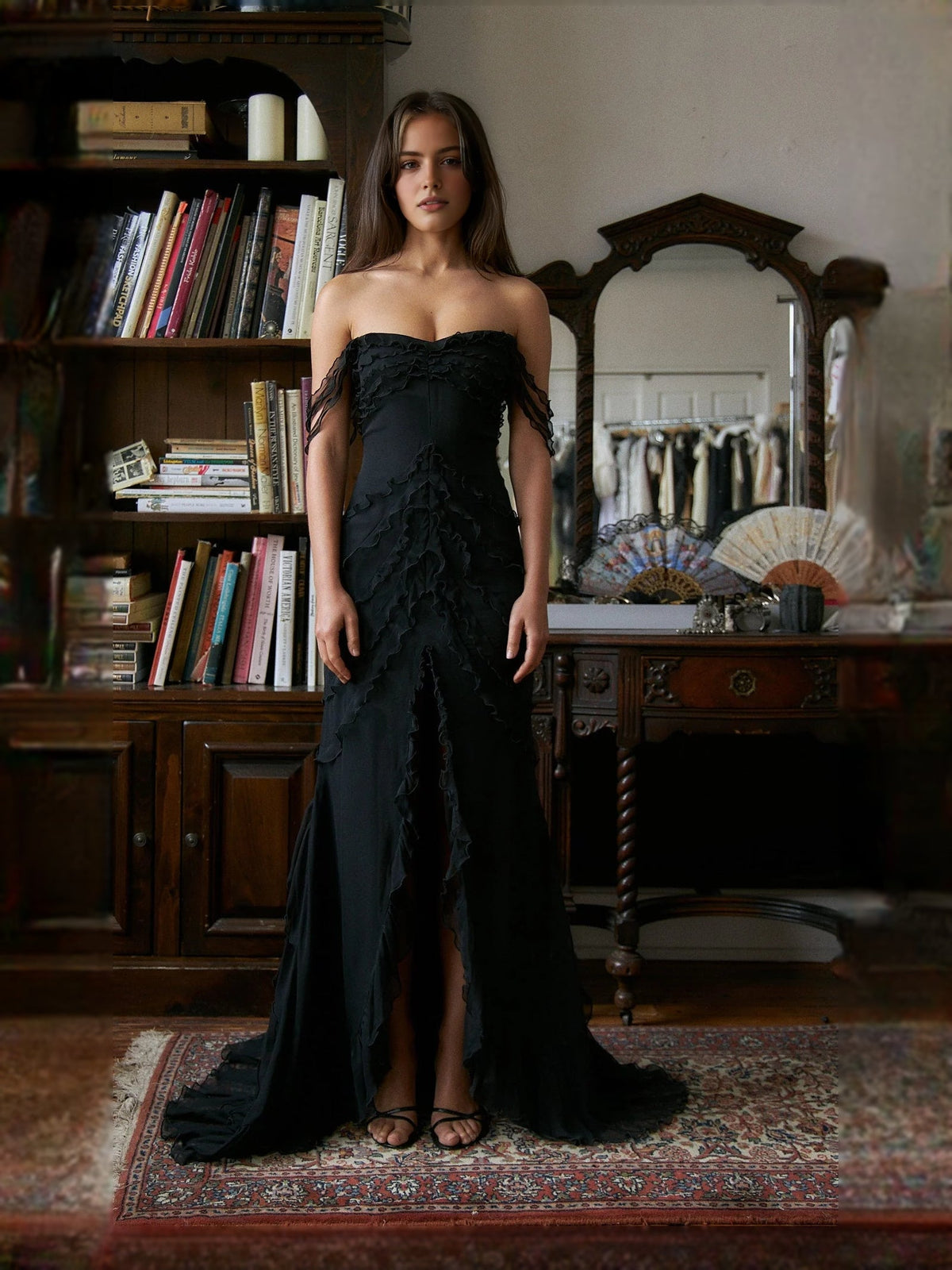 Black strapless mermaid prom dress with layered ruffle skirt and back slit, full length
