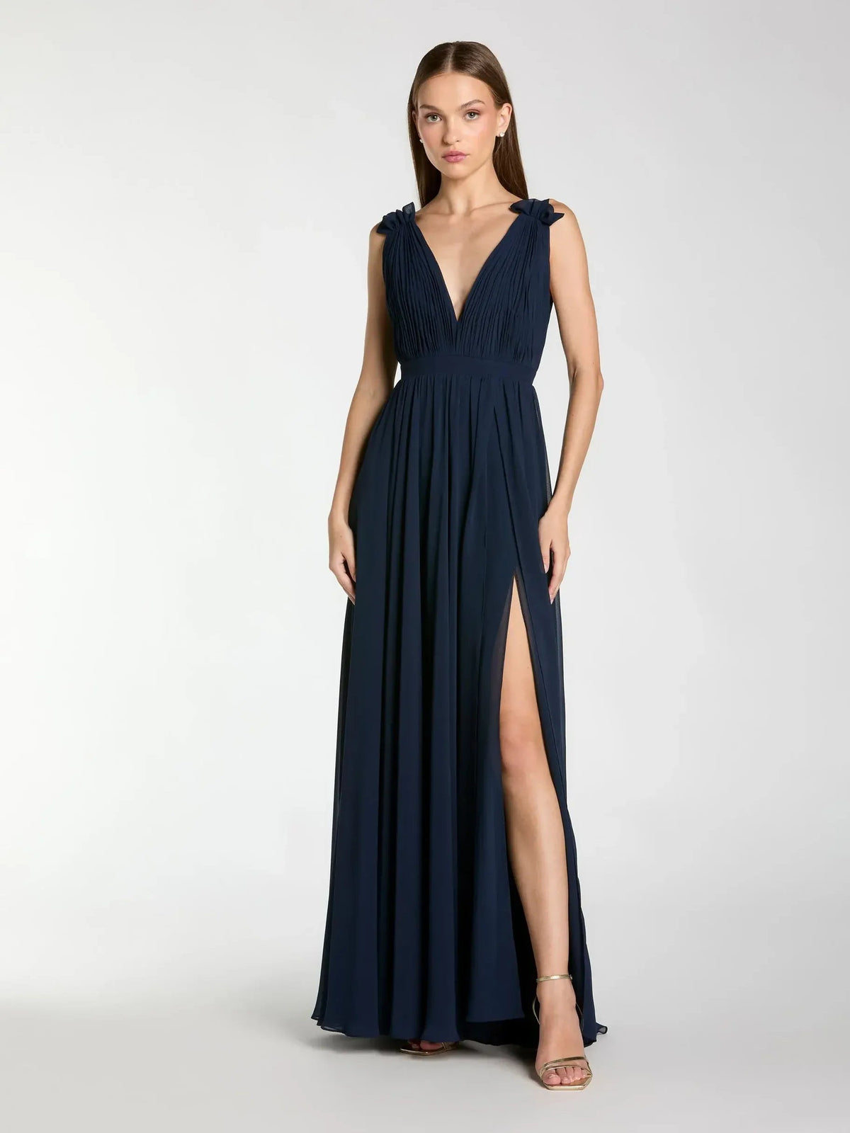 Dark navy v-neck formal dress with ruching, ruffle straps, and front slit