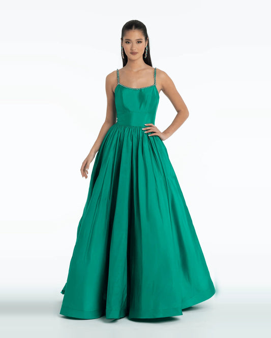 Emerald green pleated ball gown with beaded neckline and thin straps, floor-length