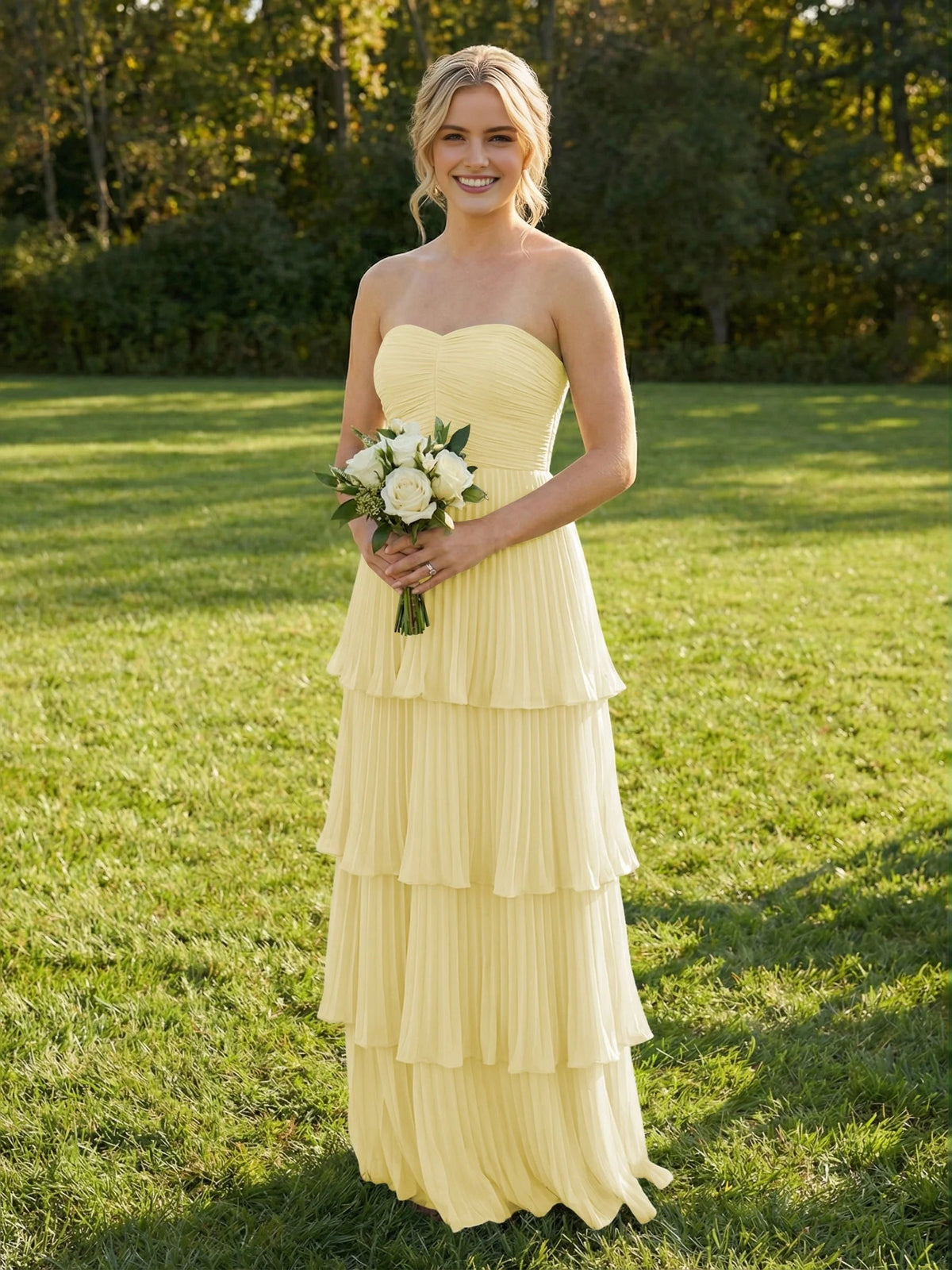Pale lemon chiffon maxi bridesmaid dress, sweetheart bodice, tiered ruffles.