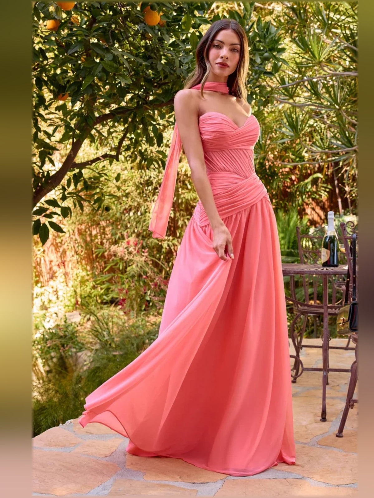 Blush pink sweetheart chiffon formal dress with halter neck, ruched bodice, draped sash