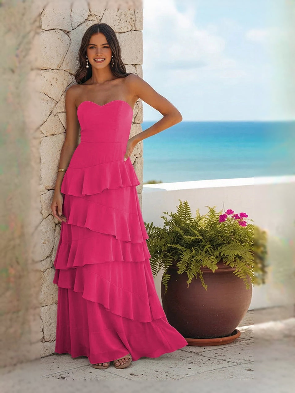 Hot pink strapless sweetheart maxi dress with layered ruffle tiers and peplum bodice