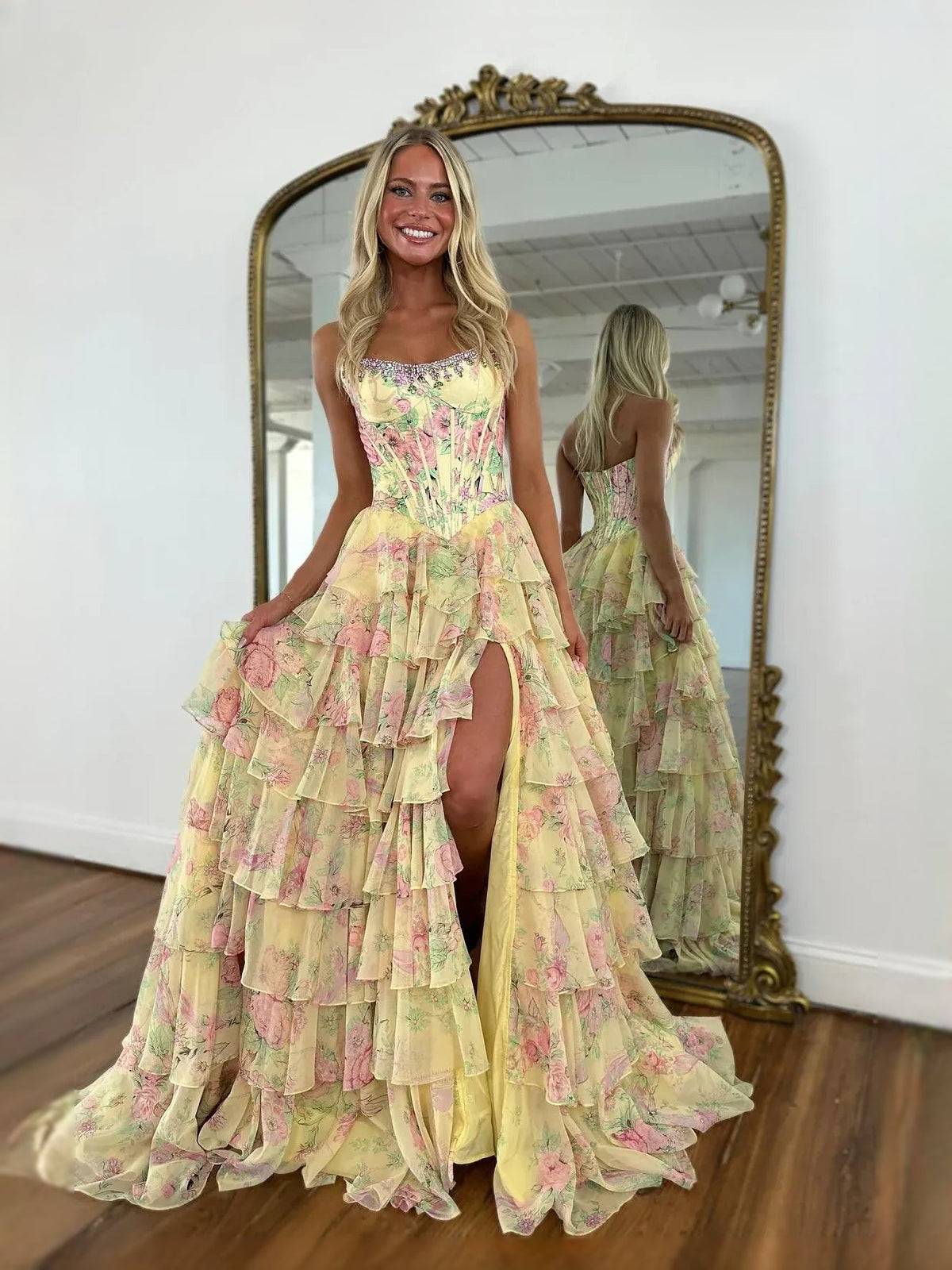 Yellow floral corset-style sweetheart A-line prom dress with tiered ruffles and open back