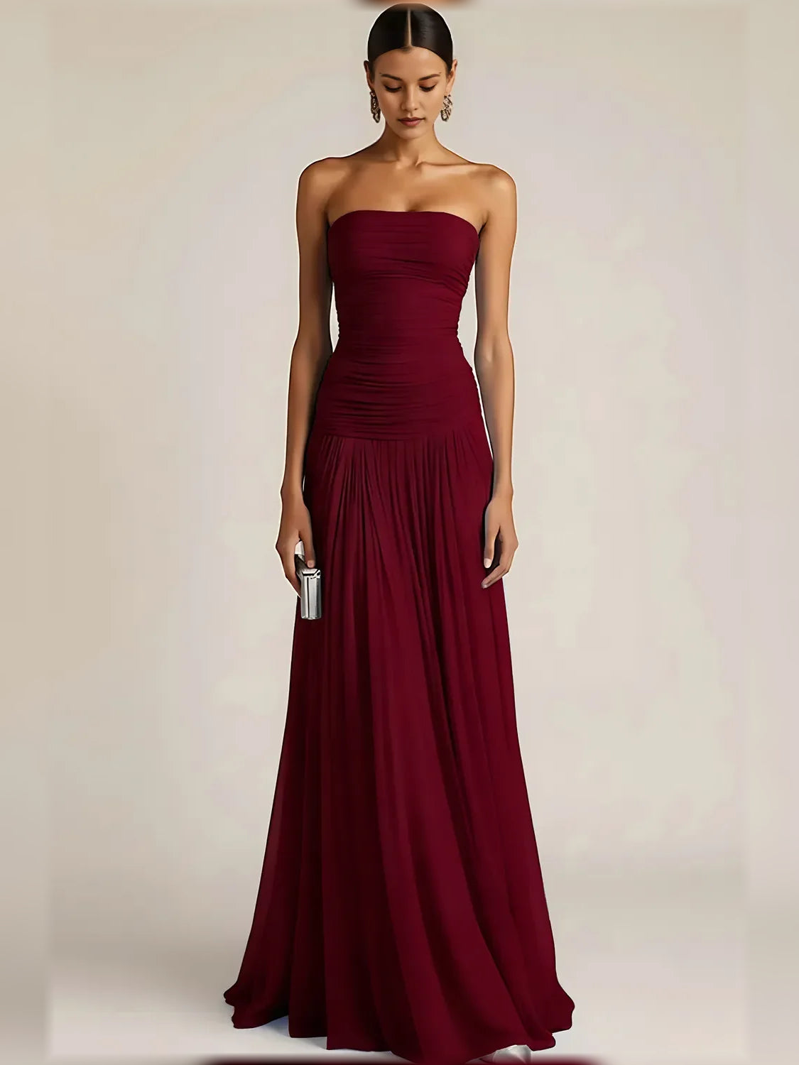 Burgundy strapless formal dress with ruched bodice and pleated floor-length skirt