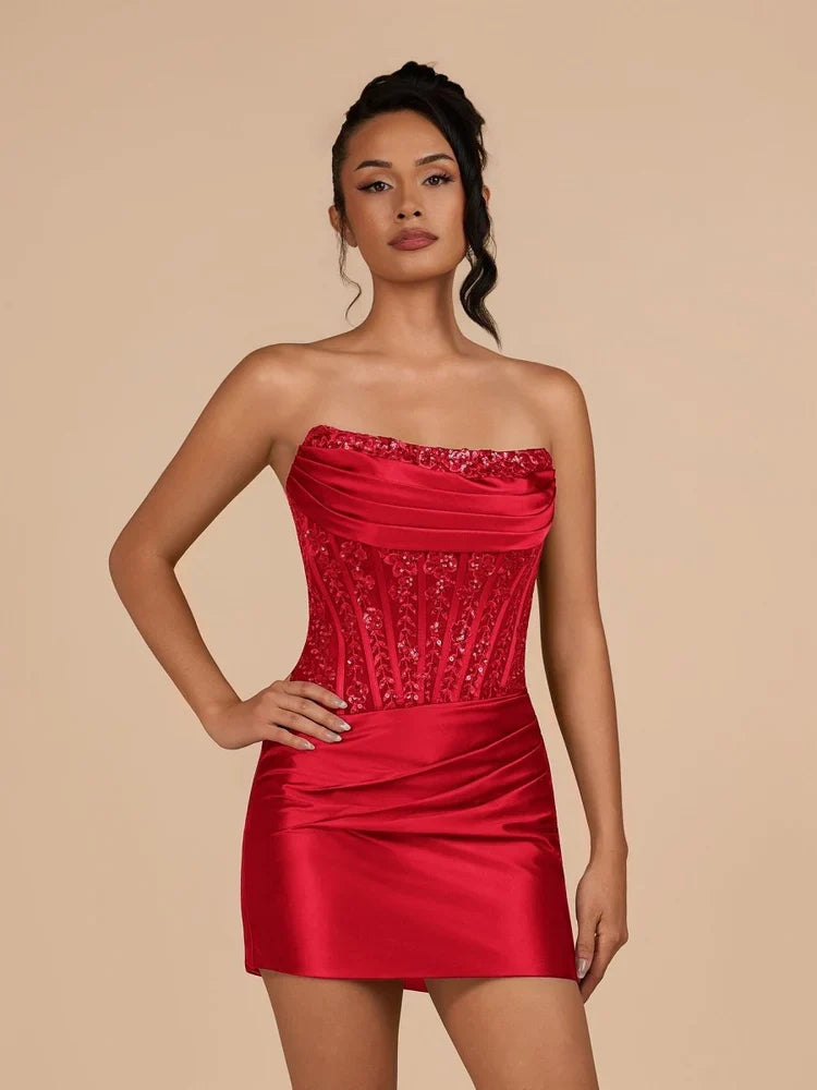 Red strapless ruched satin mini dress with draped bodice and corset-style embellishments