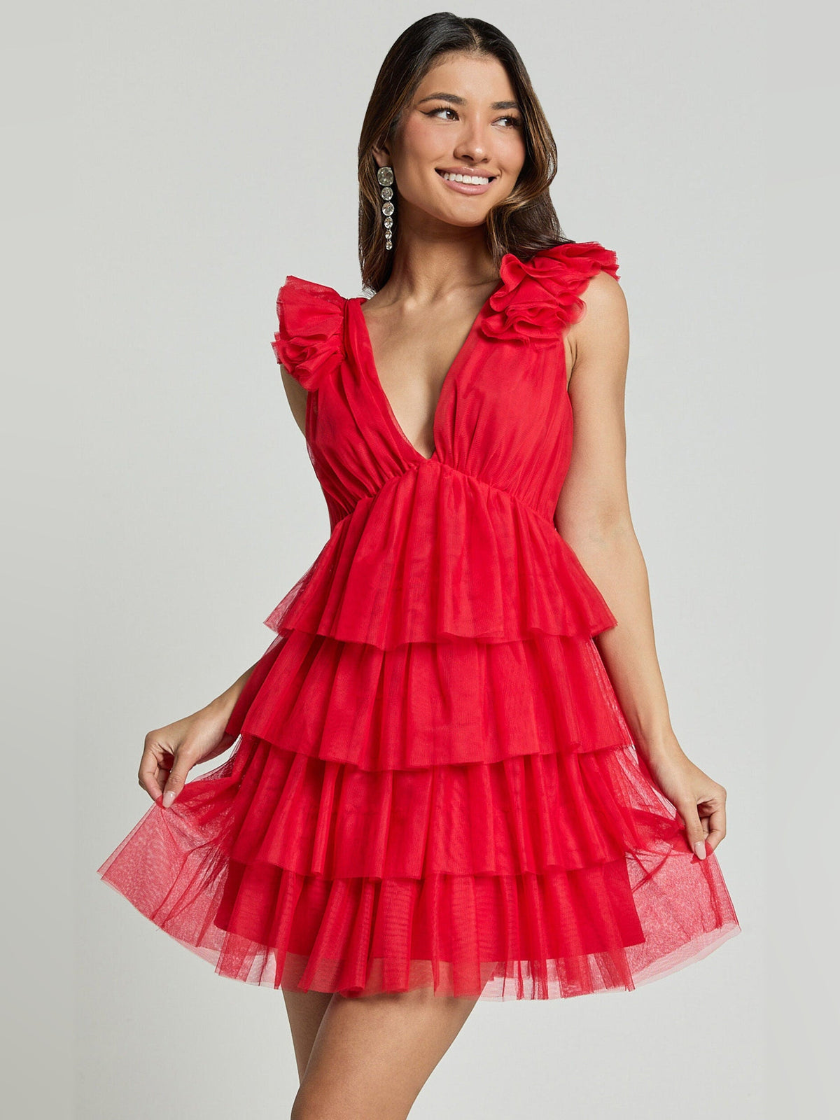 Red tiered tulle mini dress with deep V-neck, sleeveless ruffles, and flared layered skirt