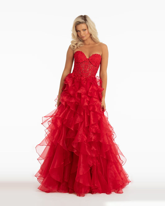 Red strapless corset ball gown with voluminous ruffled tulle skirt, floor length.