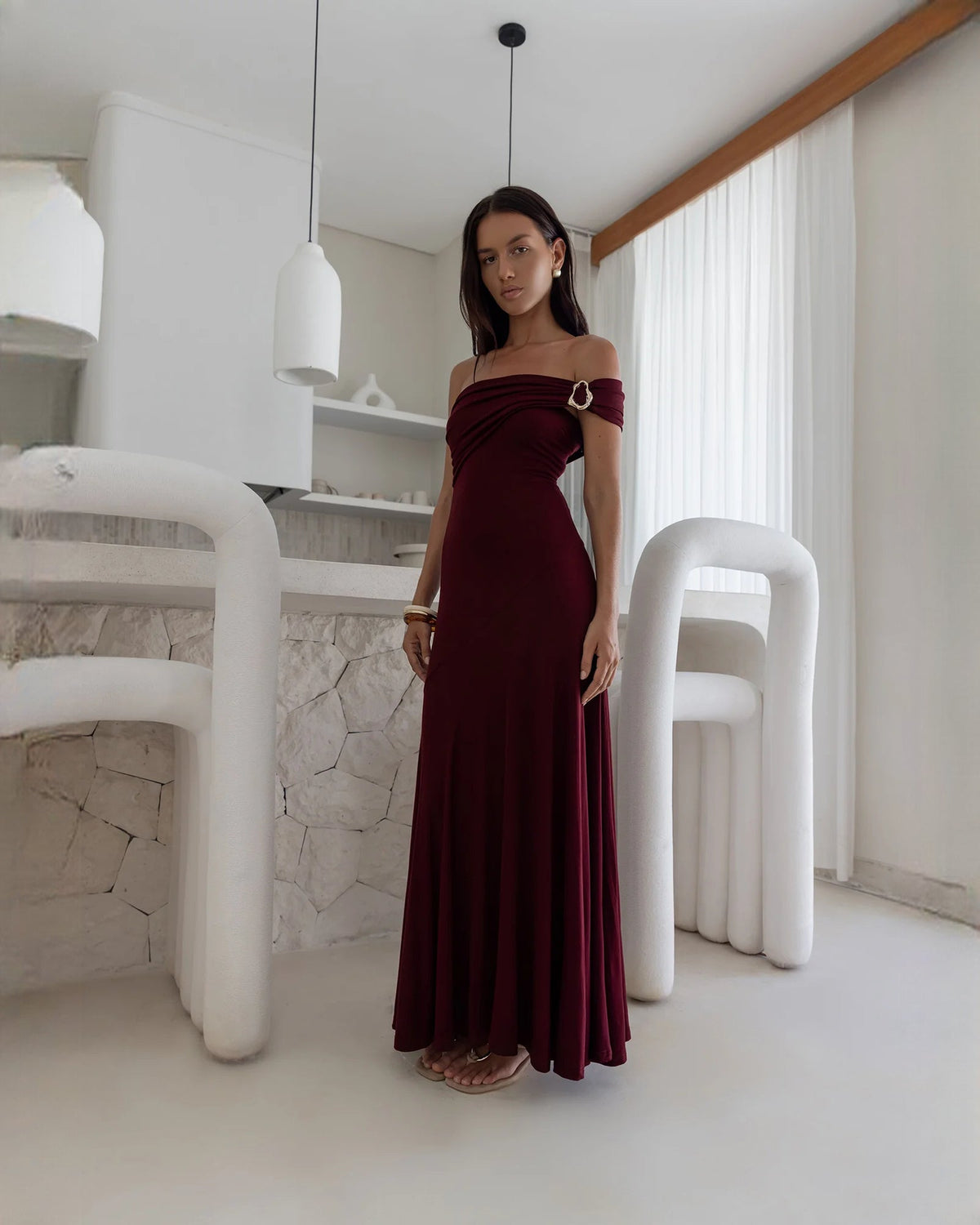 Wine red off-shoulder A-line maxi dress, draped neckline and ring detail at the shoulder
