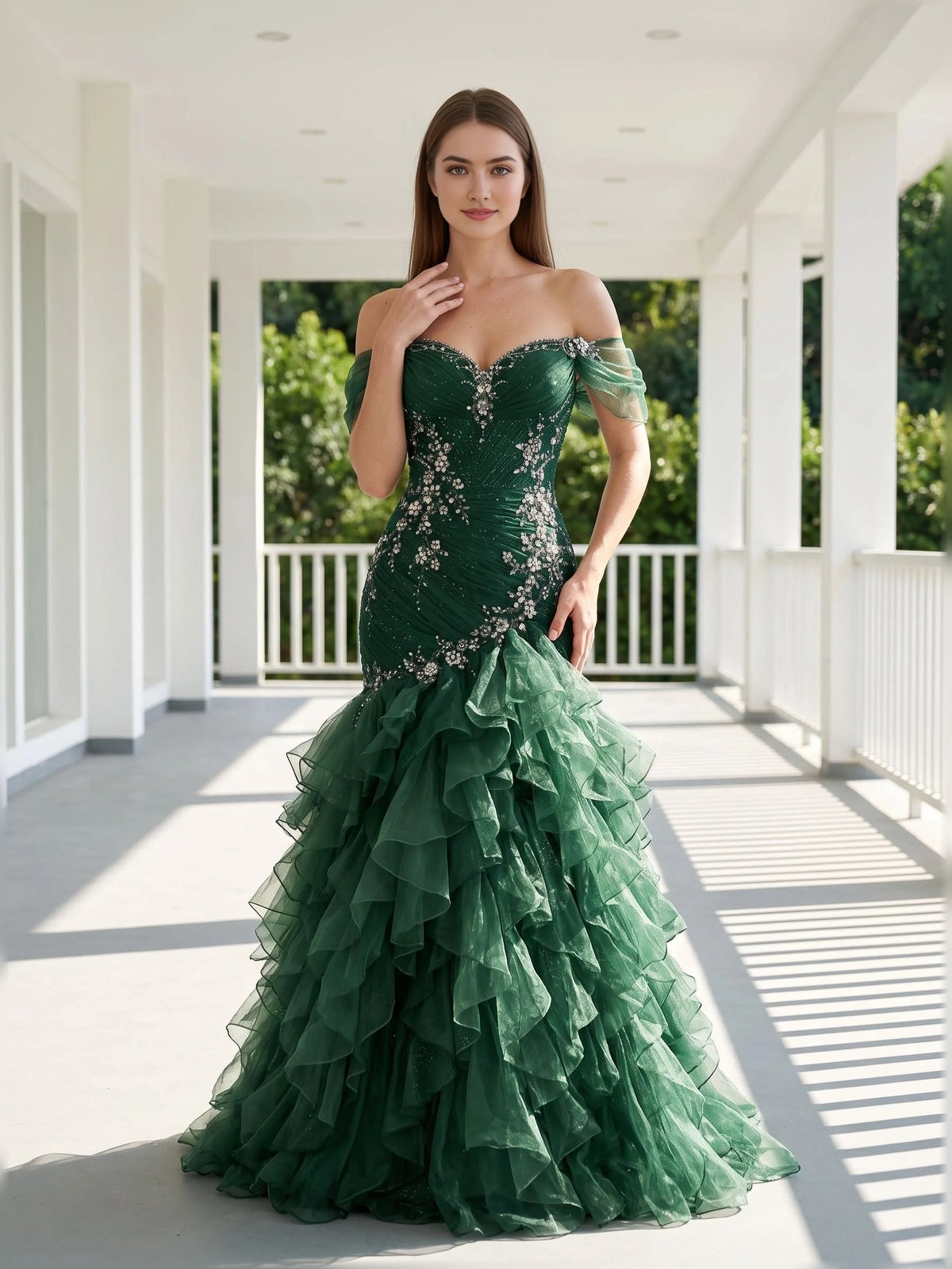 Emerald green off-shoulder corset evening dress with ruched details and floor-length tiered skirt