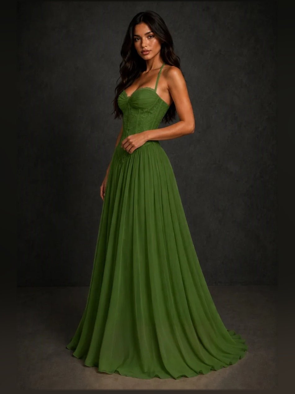Emerald green A-line prom dress with sweetheart neckline, spaghetti straps, pleated skirt.