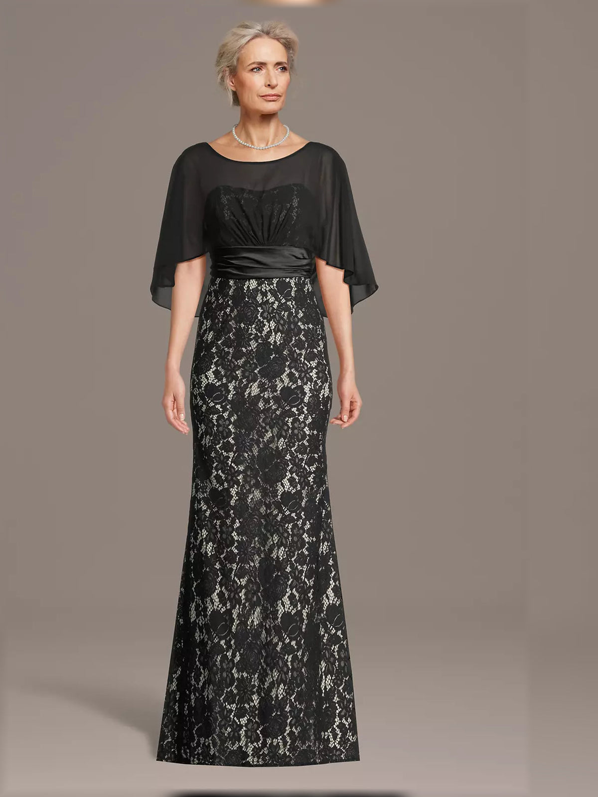 Black lace mermaid maxi dress with sheer cape sleeves and ruched satin waist detail