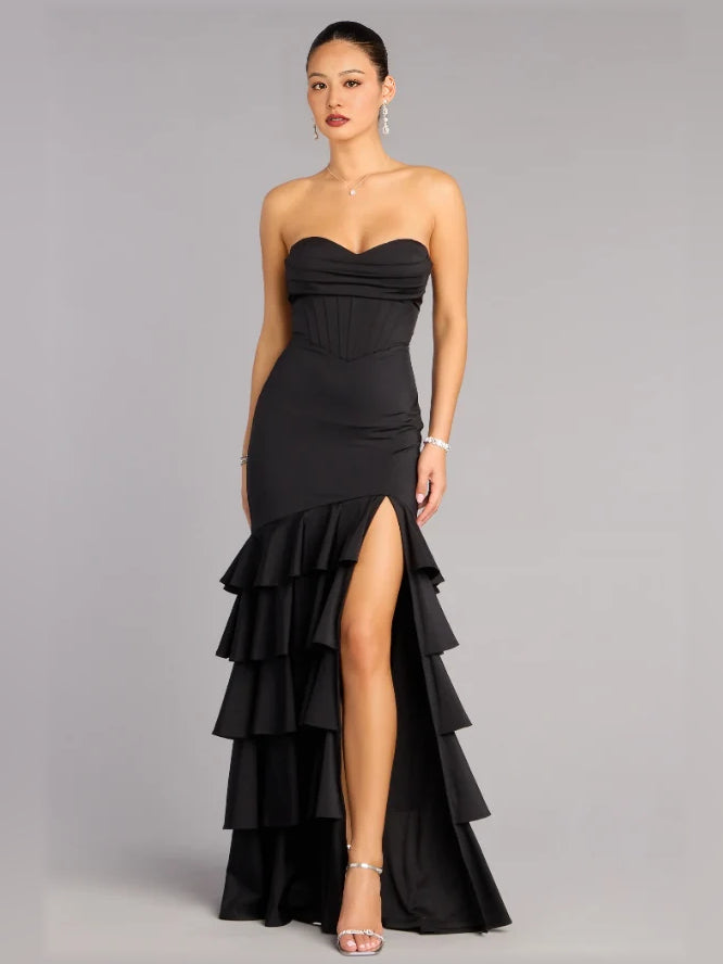 Black strapless corset formal dress with tiered ruffle skirt and draped bodice