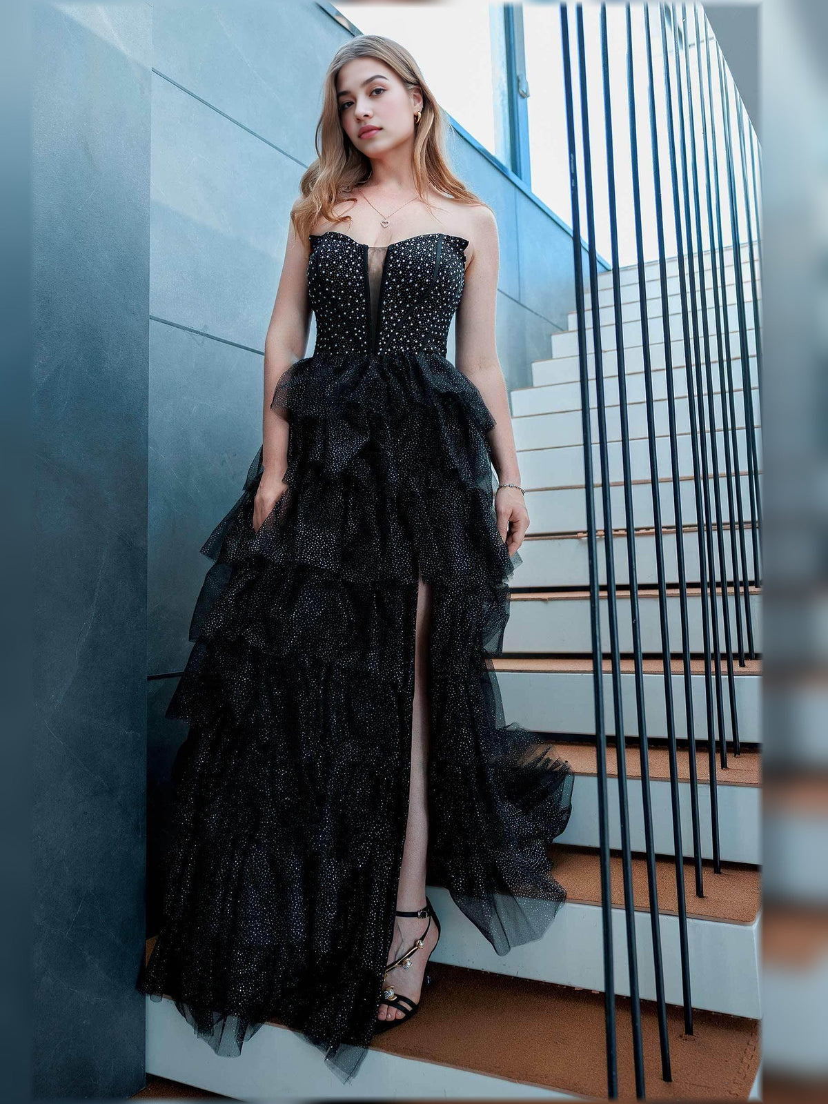 Black strapless tiered ruffle floor-length gown with front slit