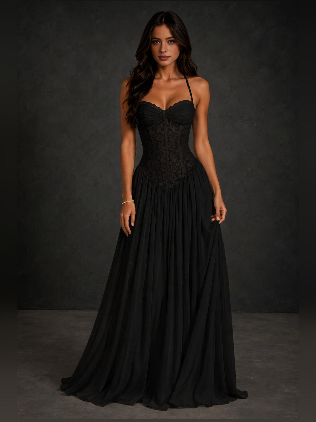 Black A-line prom dress with sweetheart neckline, spaghetti straps, pleated skirt.