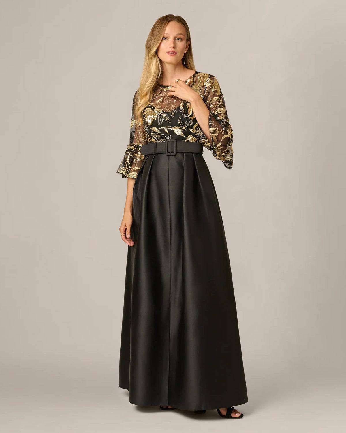 Black A-line maxi dress with gold embellished bodice and satin belt, 3/4 sleeves