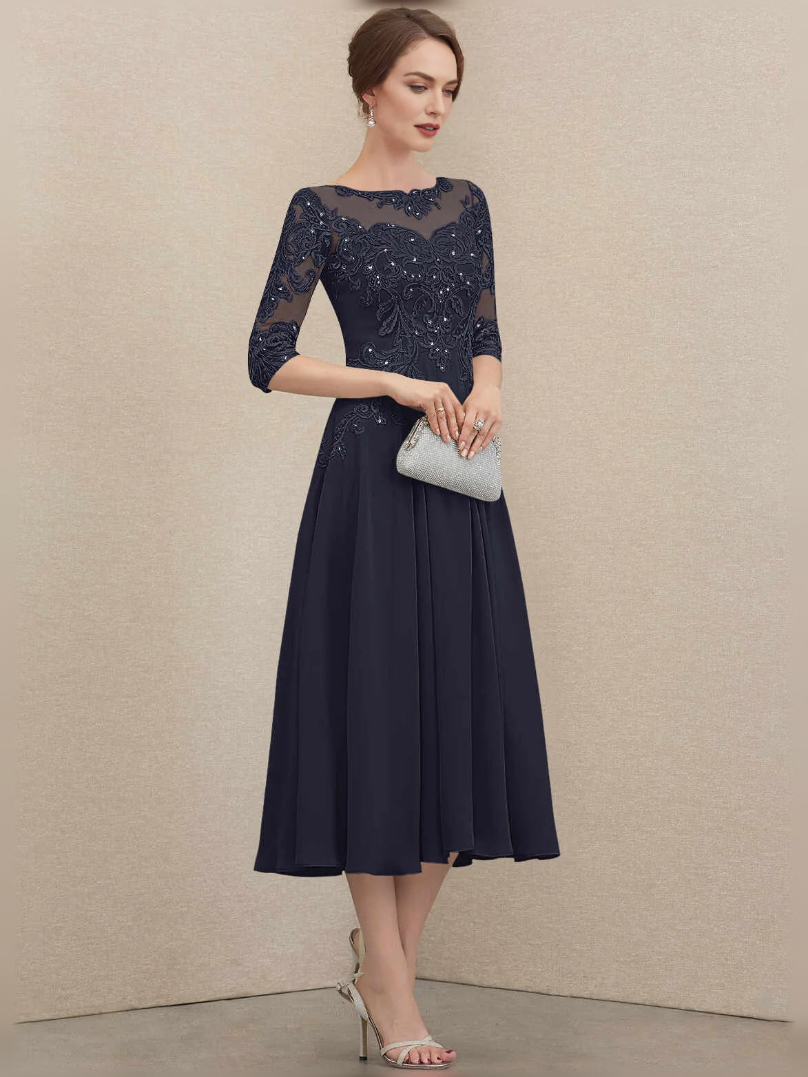 Navy chiffon A-line mother-of-the-bride dress with illusion floral lace neckline
