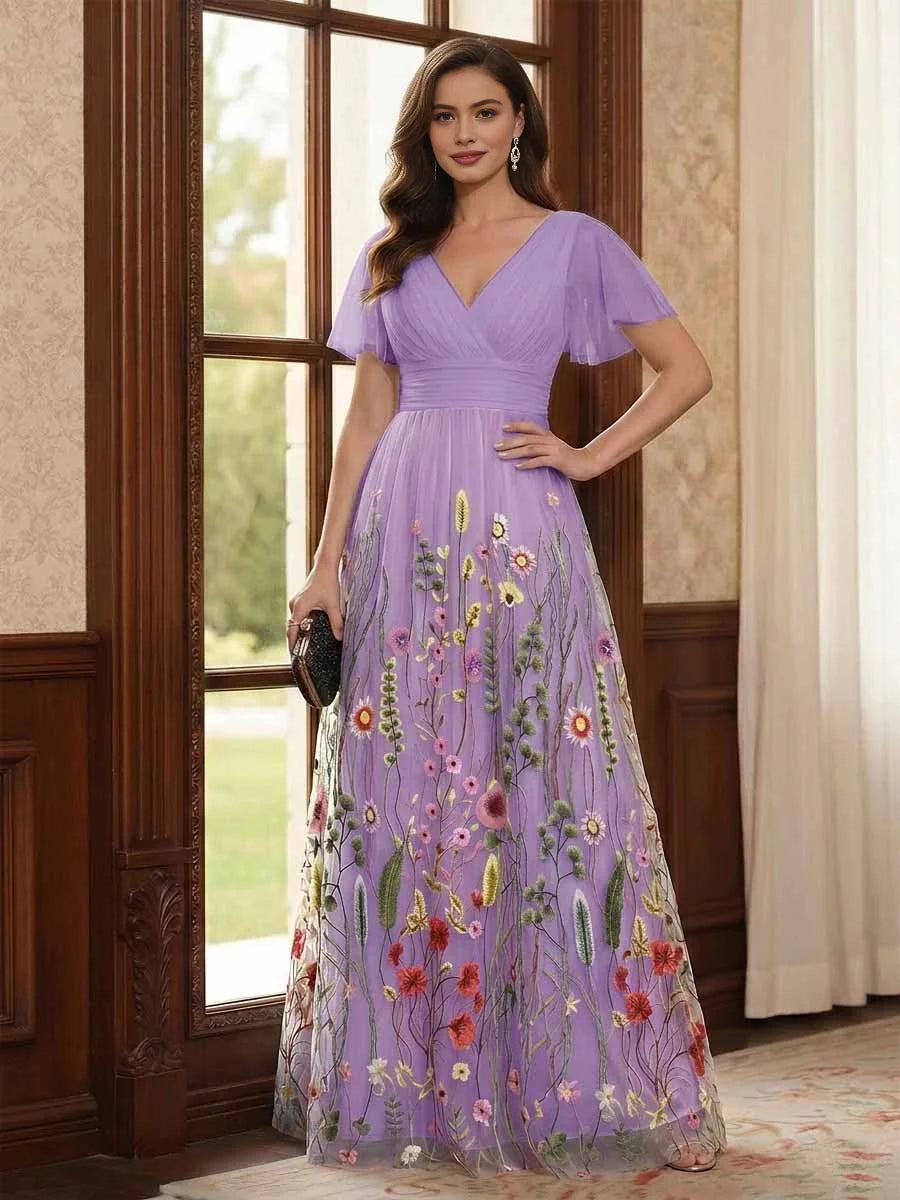 Lavender V-neck A-line tulle dress with ruched waist, flutter sleeves, floral embroidery.