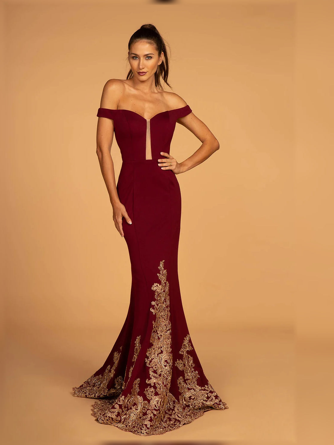 Burgundy off-shoulder formal maxi dress with gold floral hem embroidery, front view.