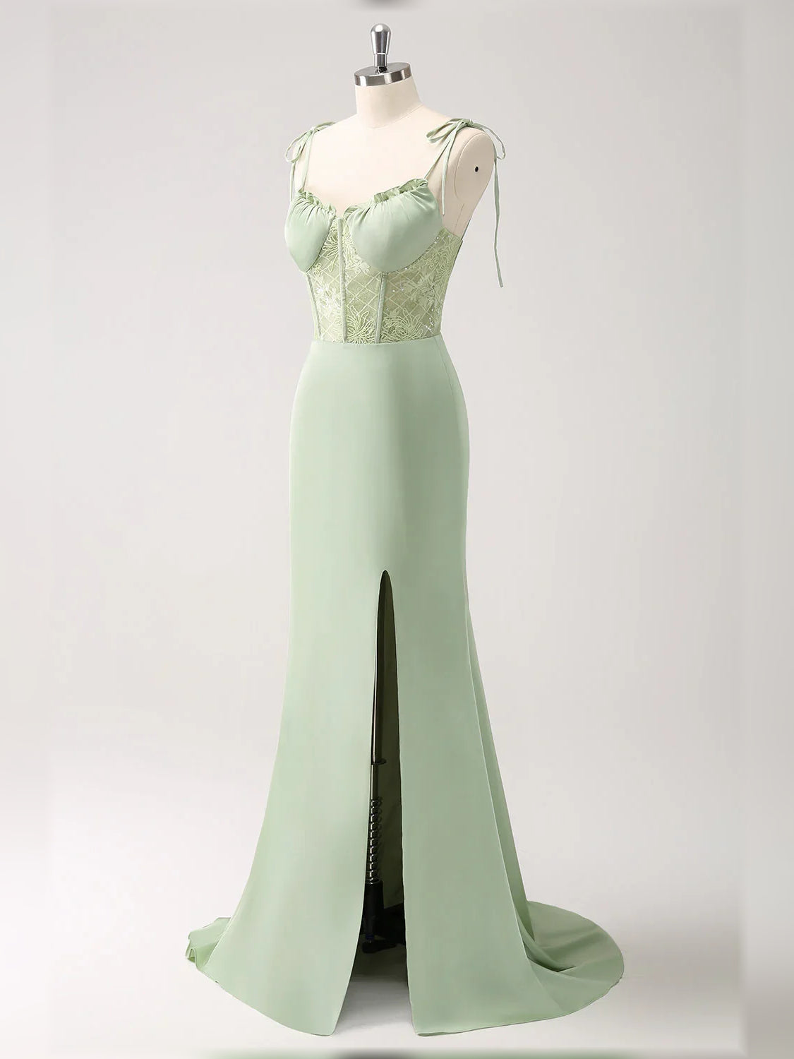 Celadon green corset formal gown with side slit and lace-textured bodice detail