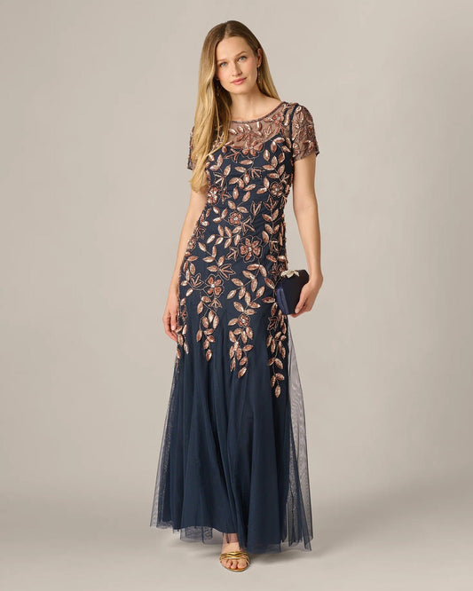 Navy A-line maxi dress in 3/4 view with short sleeves and rose-gold floral beading