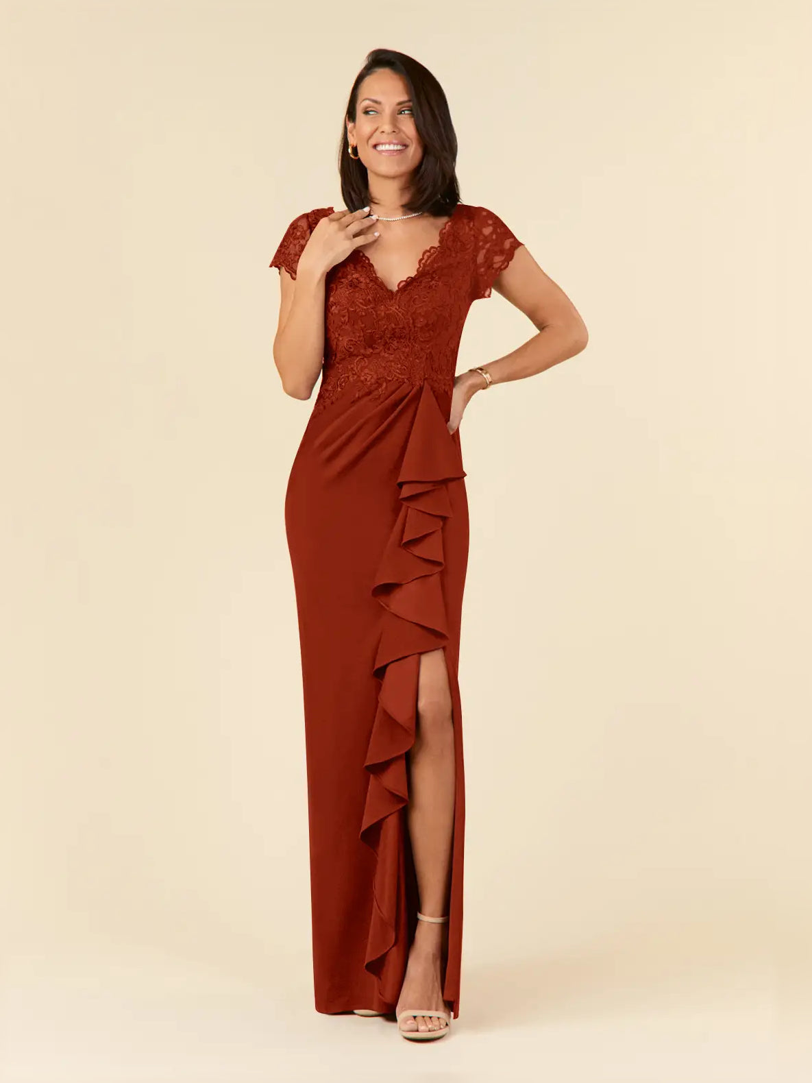 Rust red mermaid dress with V-neck lace bodice and layered ruffle side slit detail.