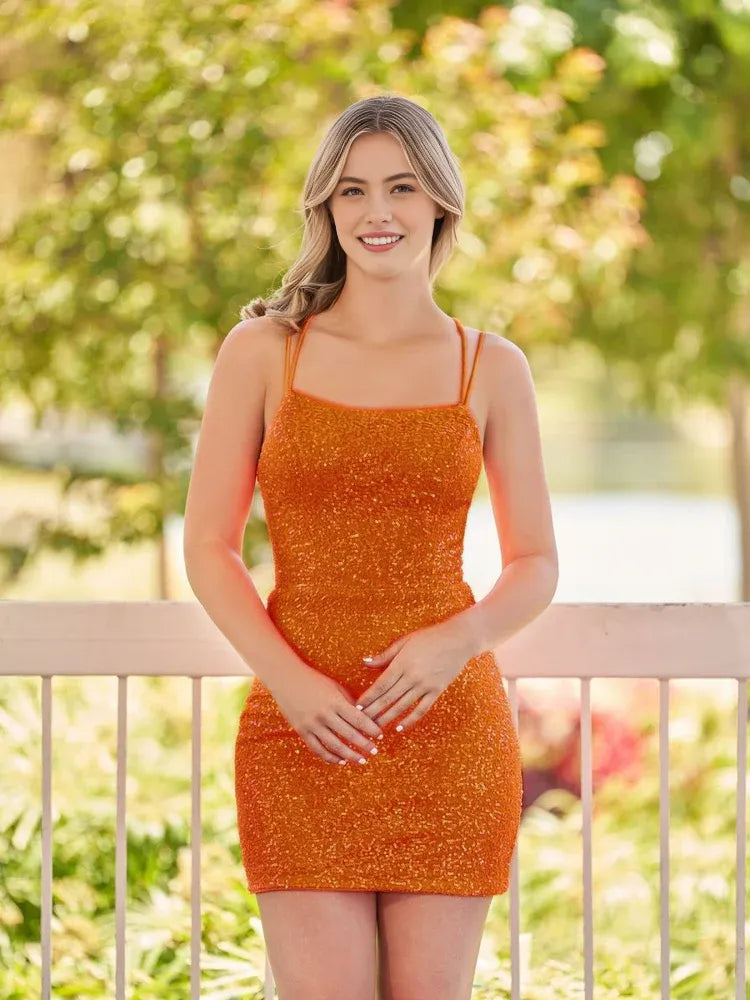 Orange sequin mini dress with spaghetti straps and fitted bodycon silhouette