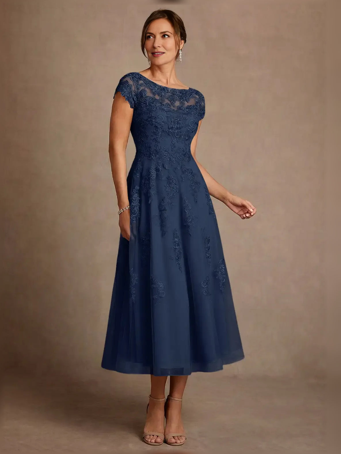 Embroidered illusion-neck A-line midi dress in dark navy, full front view with embroidered bodice