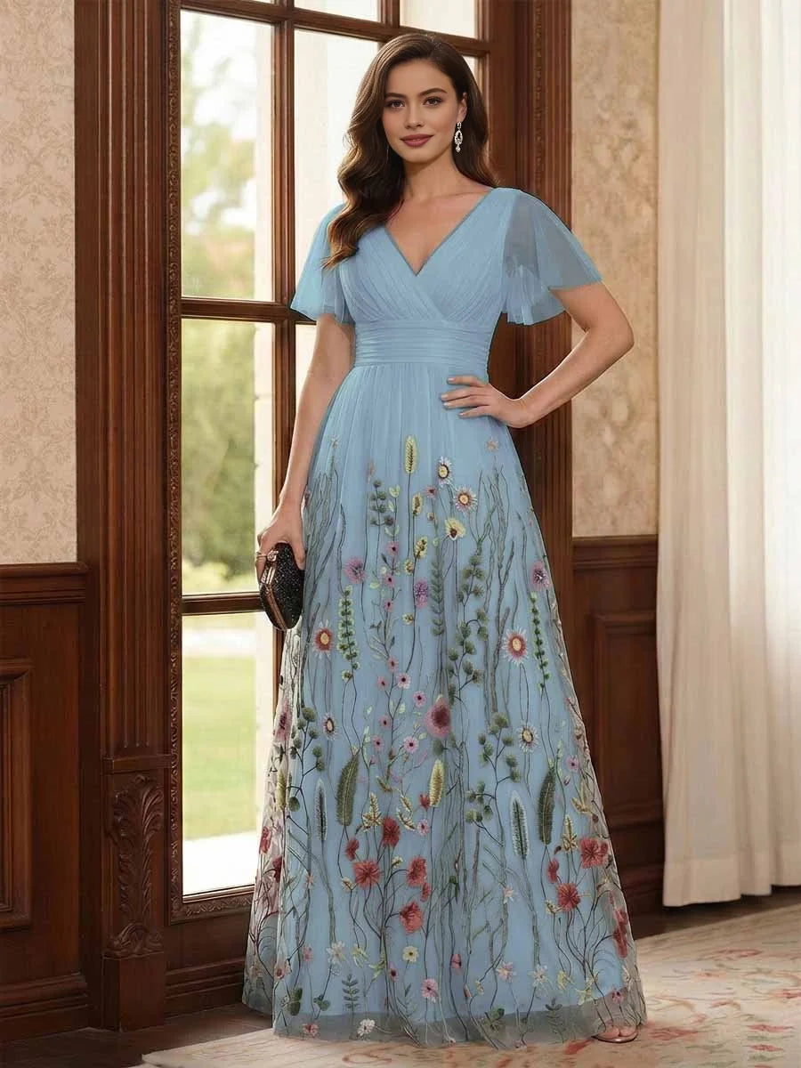 Light blue V-neck A-line tulle dress with ruched waist, flutter sleeves, floral embroidery.