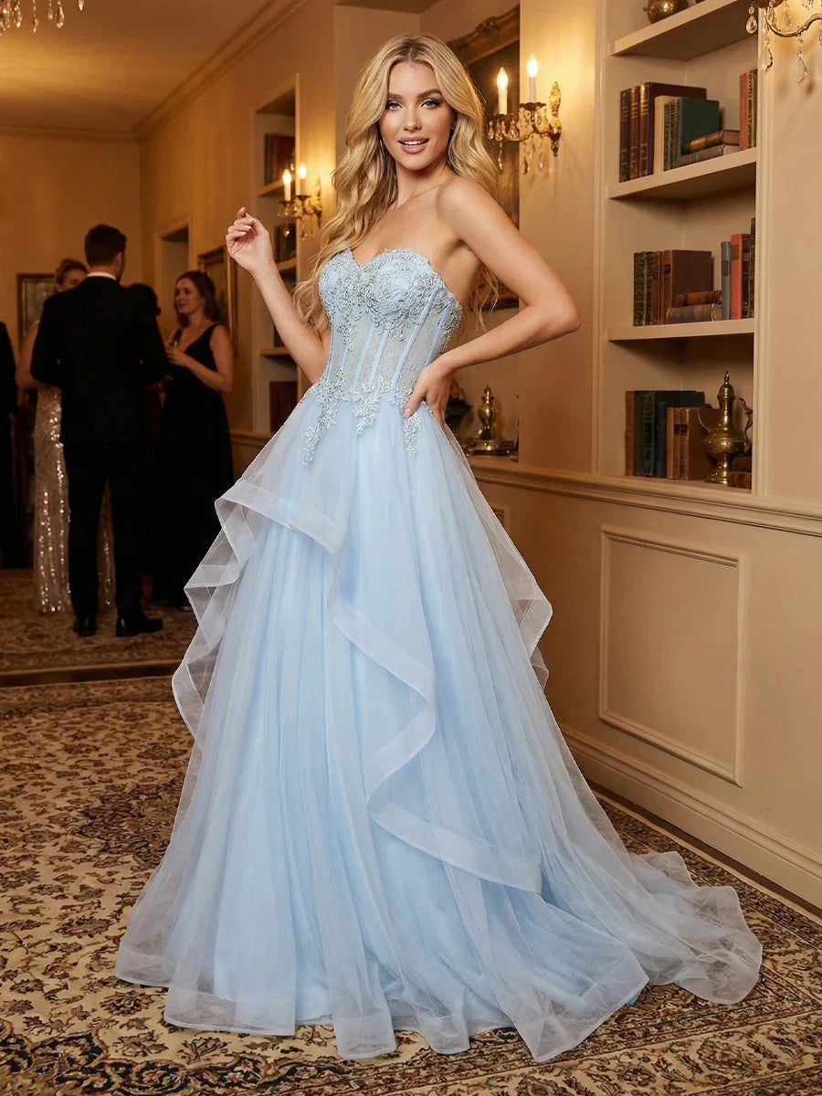 Sky blue sweetheart corset prom dress, side view, embroidered bodice and layered tulle skirt