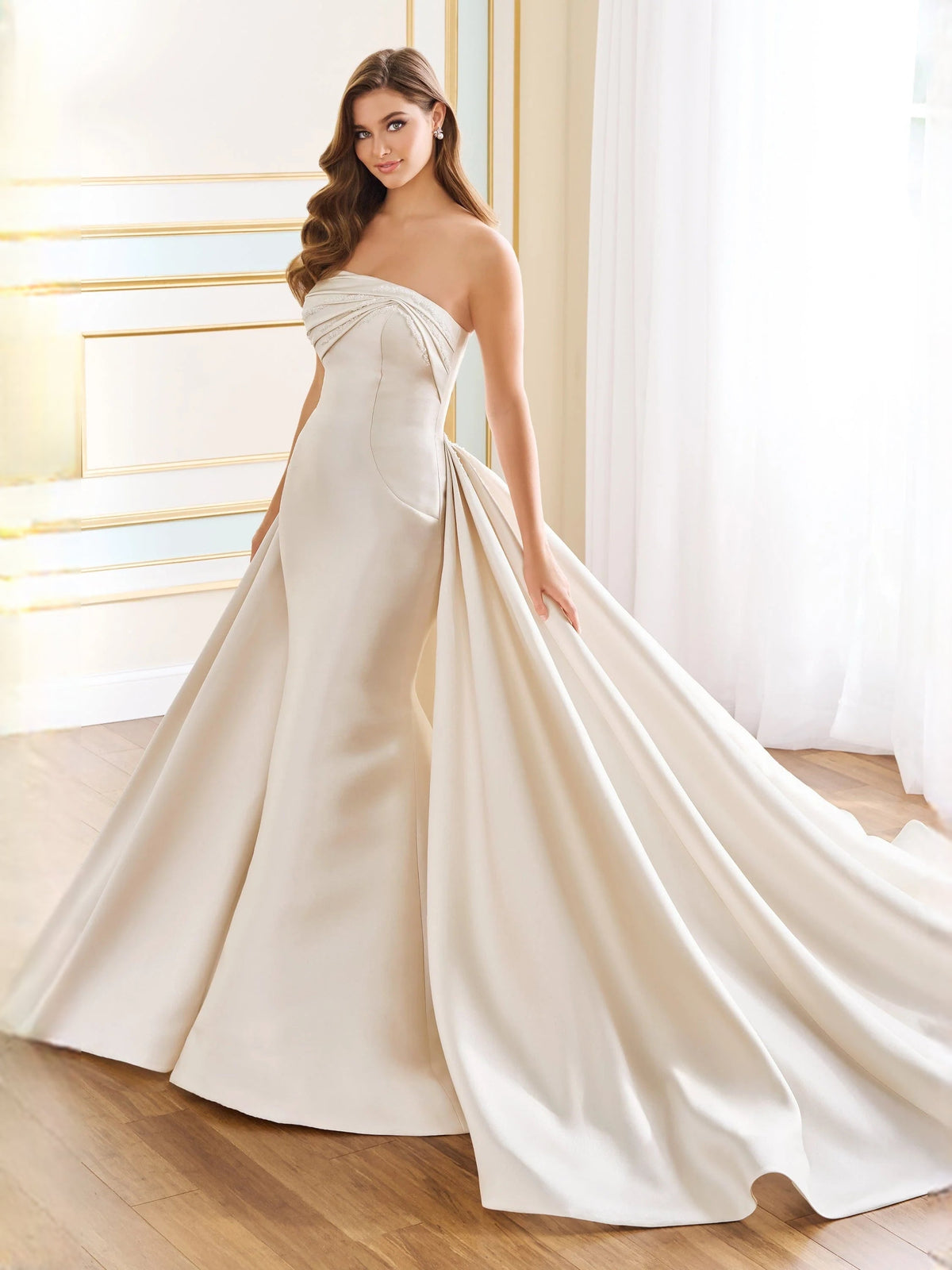 Ivory strapless satin A-line wedding dress with gathered ruched bodice and flowing floor hem