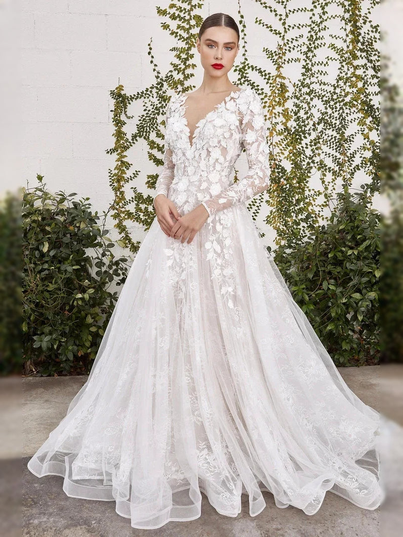 Ivory corset lace wedding dress with V-neck, long sleeves, and floor-length tulle skirt