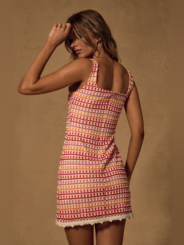 Geometric print square-neck bodycon mini dress, cream and red, sleeveless angled back view