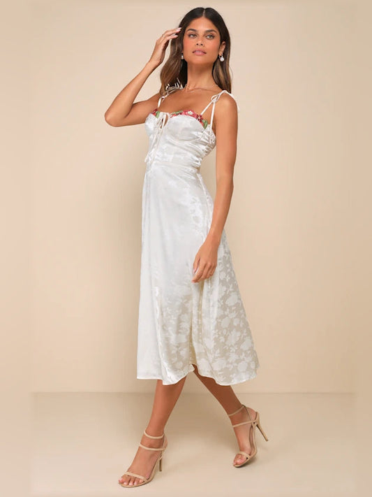 Cream satin midi dress with bow straps, ruched bust and embroidered hem panel