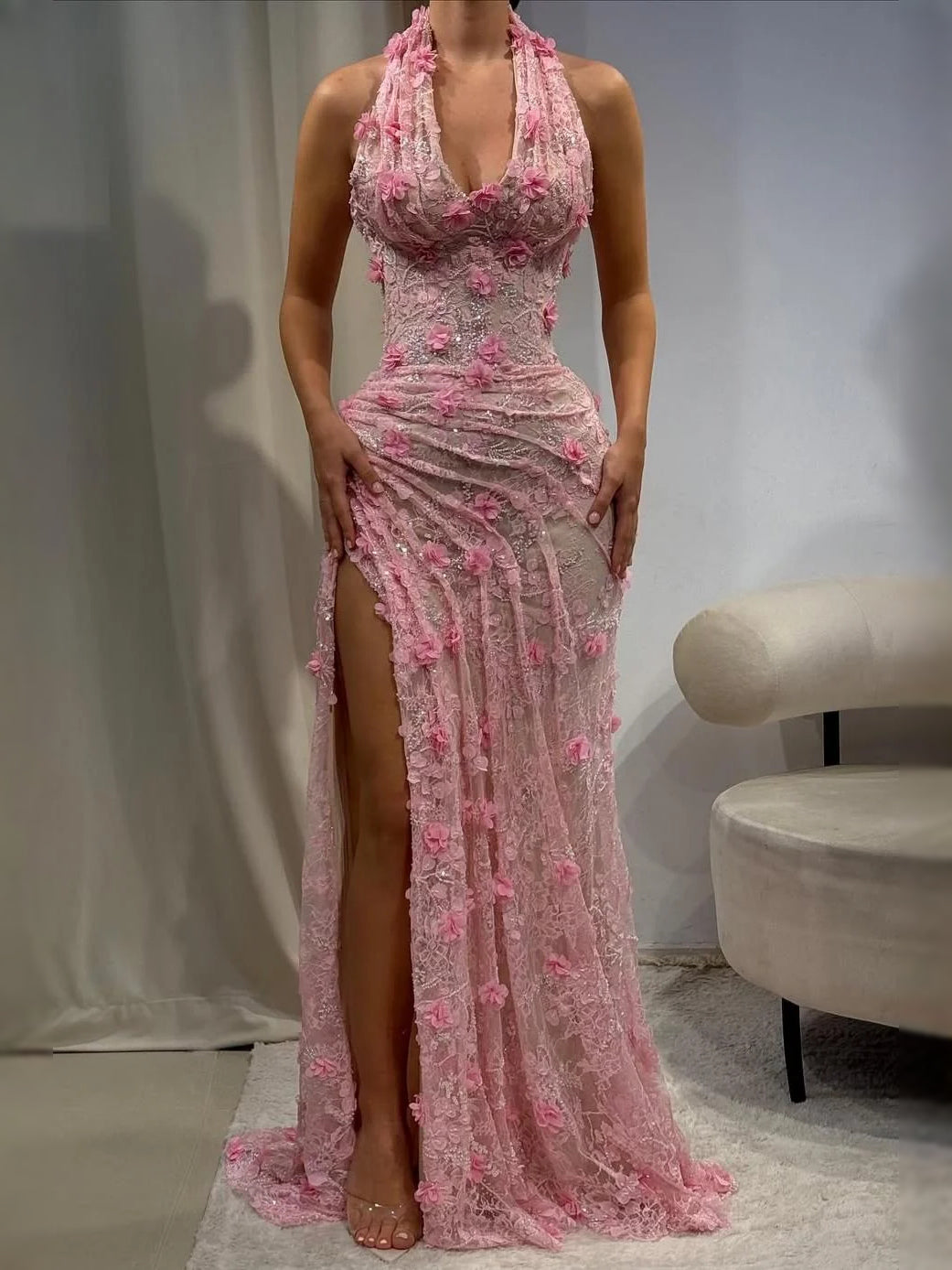 Pink halter-neck mermaid maxi prom dress with lace texture and thigh slit