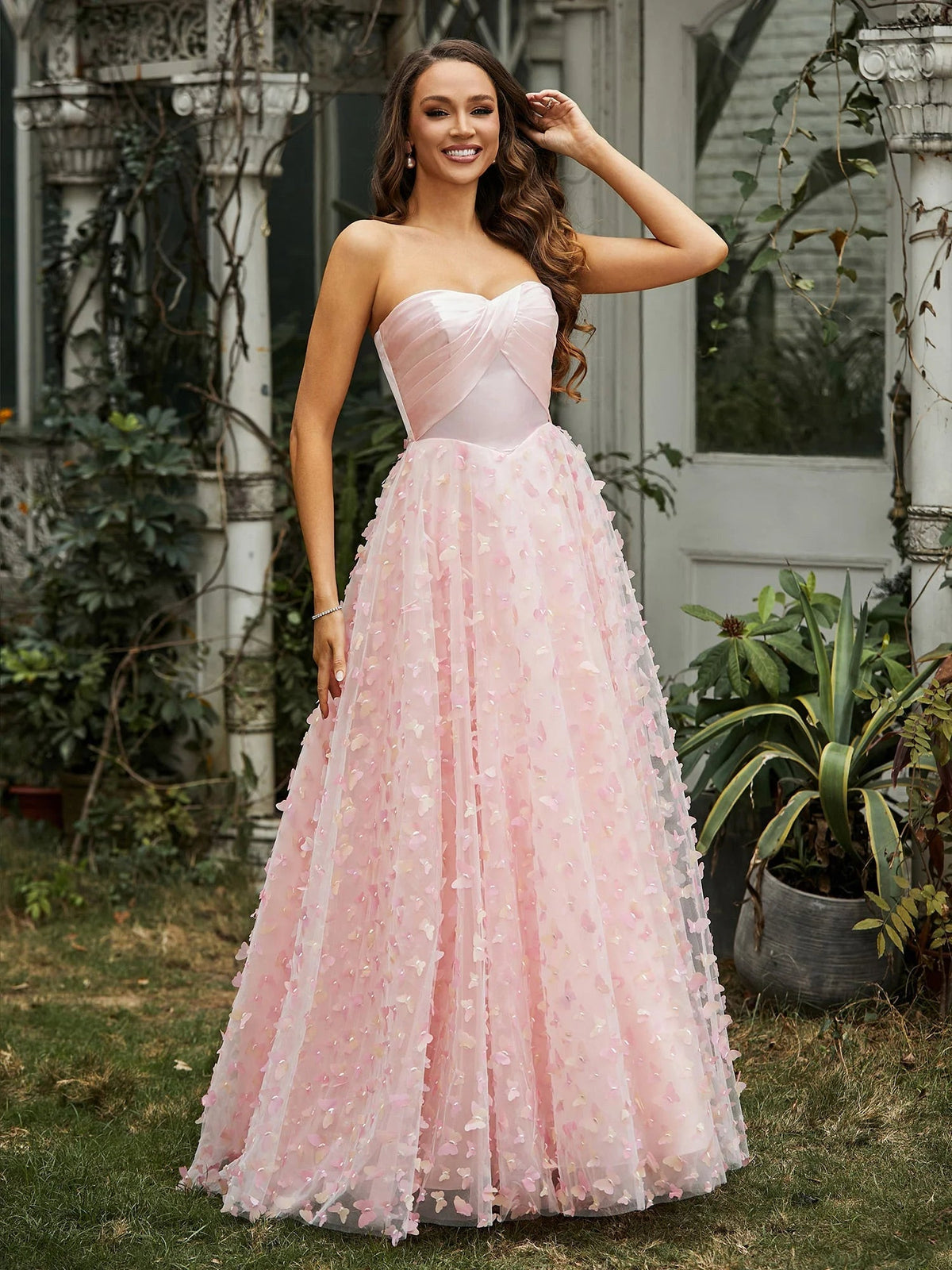 Pink sweetheart ball gown with corset-style satin bodice and sparkly floral tulle skirt