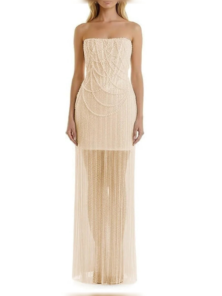 Champagne strapless corset-style formal dress with beaded swirl bodice and fringe maxi hem