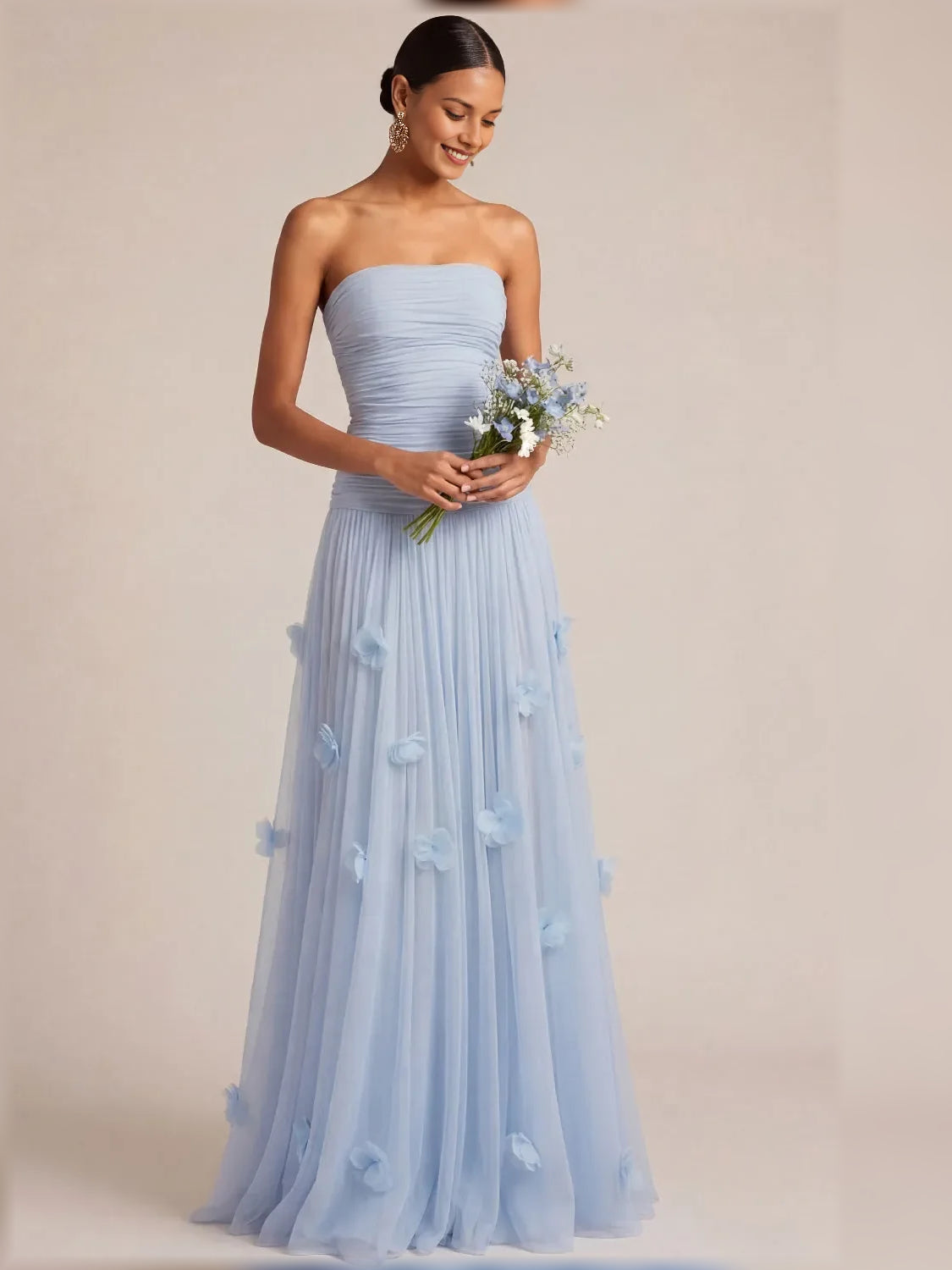 Light blue strapless formal dress with ruched bodice and floral appliques, full length