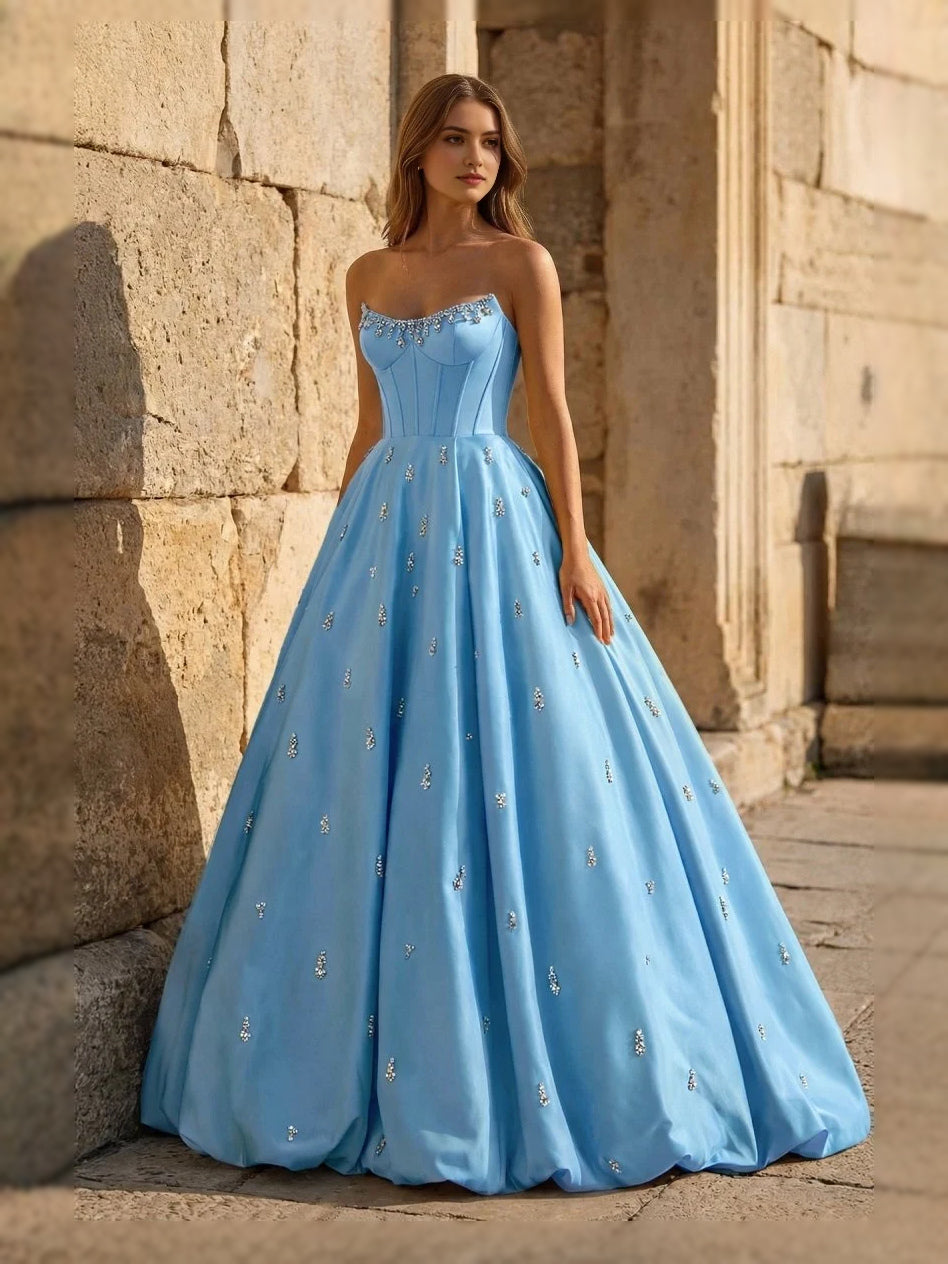 Light blue sweetheart corset ball gown with thin straps and full floor-length skirt, front view