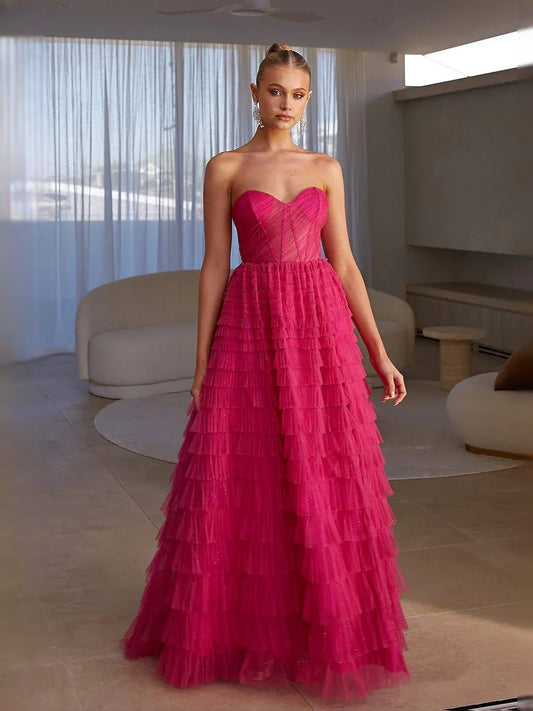 Hot pink strapless sweetheart tiered tulle maxi prom dress with corset bodice