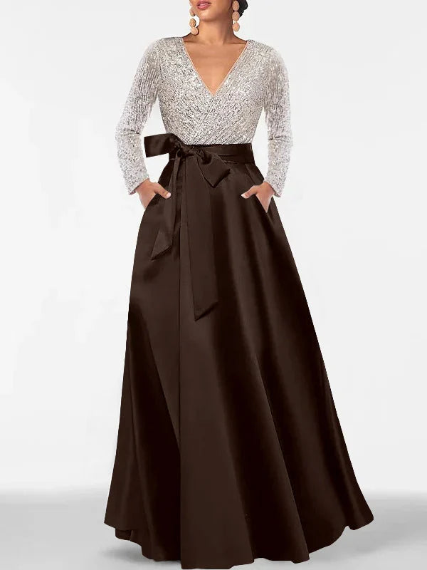 V-neck formal dress with silver sequin bodice, dark brown pleated maxi skirt, waist tie