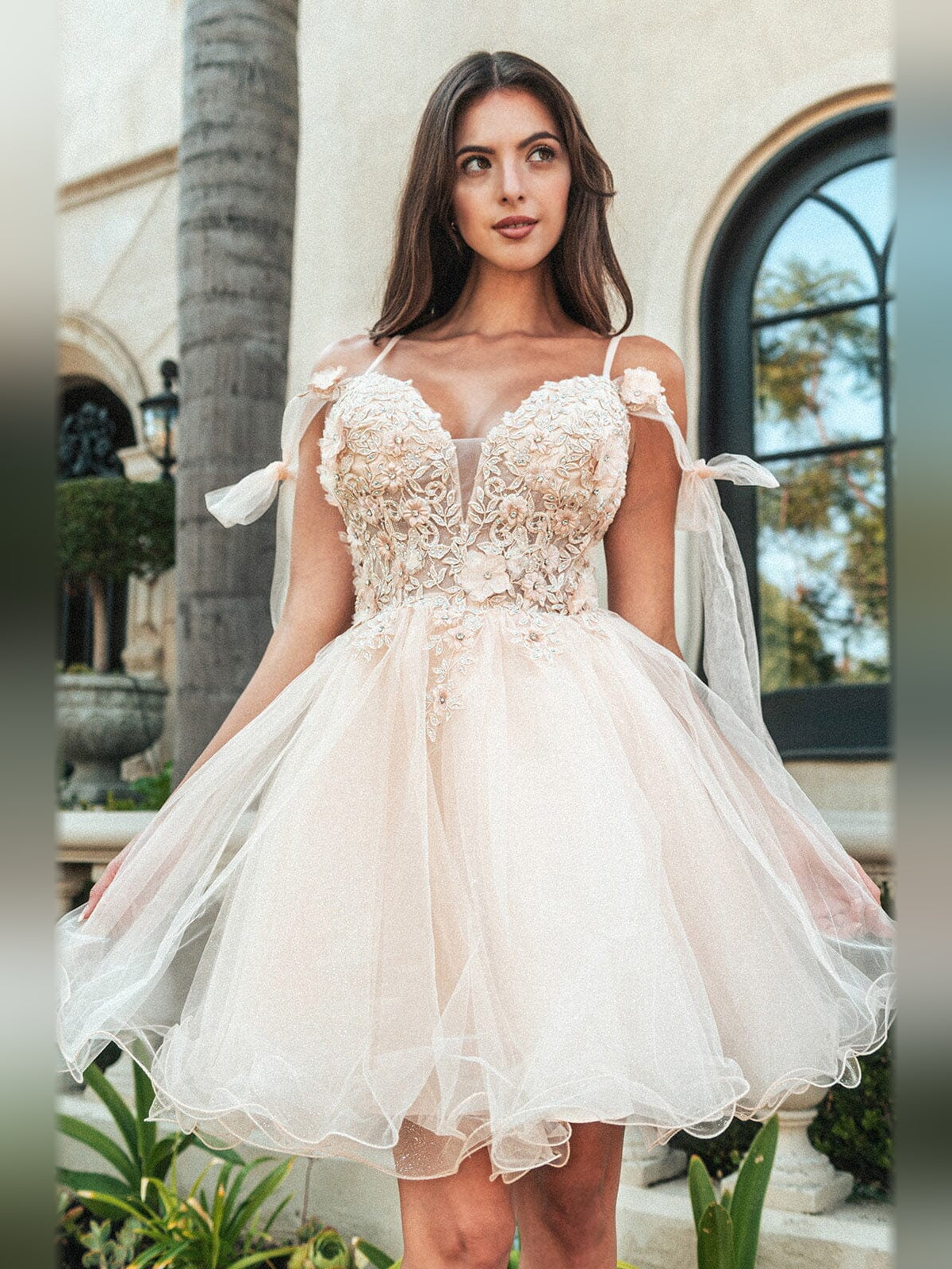 Champagne tulle A-line homecoming dress with floral applique bodice and bow sleeves