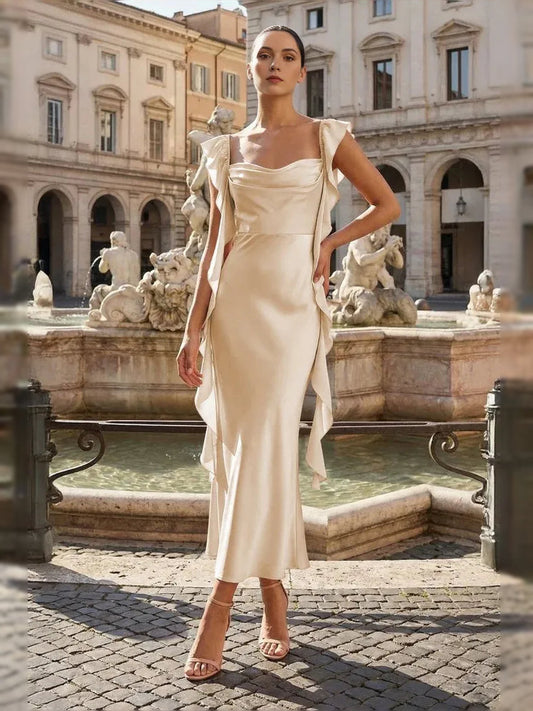 Champagne satin prom dress featuring cowl neck and ruffled shoulder straps, column midi silhouette