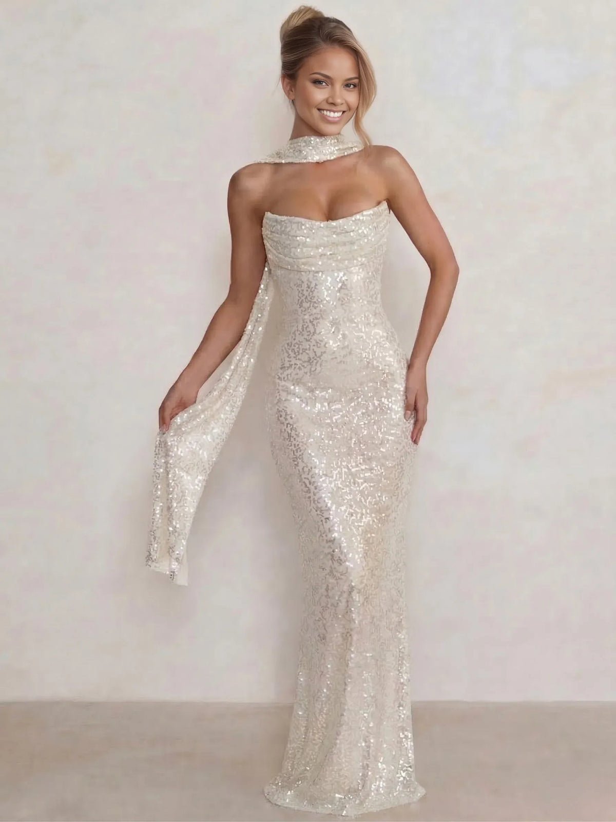 Champagne sequined halter mermaid gown with floor-length fitted silhouette and draped sleeves