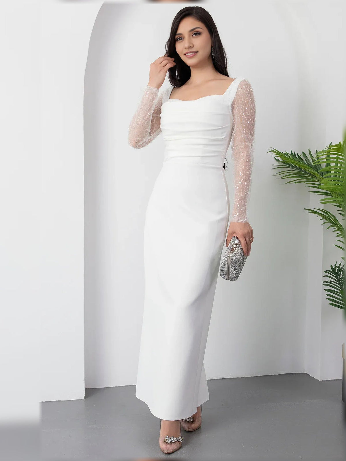 White square-neck formal dress with sheer long sleeves and ruched bodice, floor-length